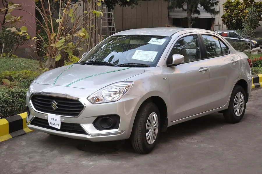 White Maruti Suzuki Dzire sedan